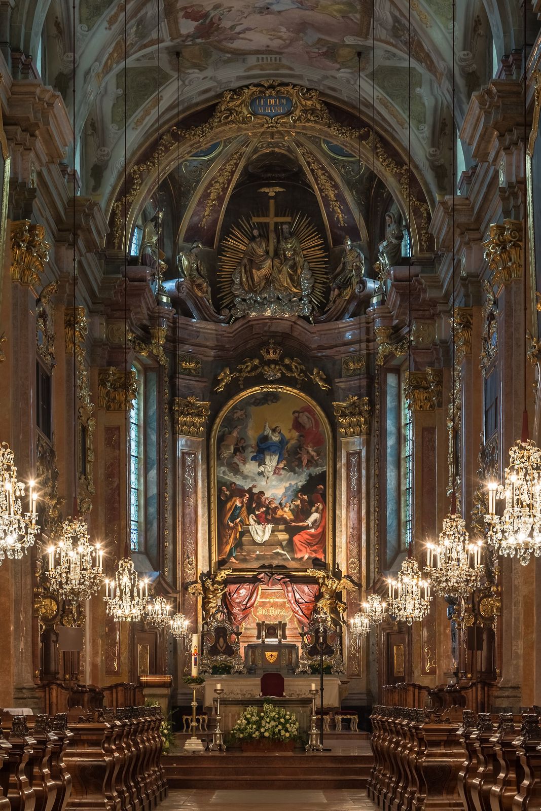 The baroque high altar of St. P&ouml;lten Cathedral in Austria, lit by candles and chandeliers